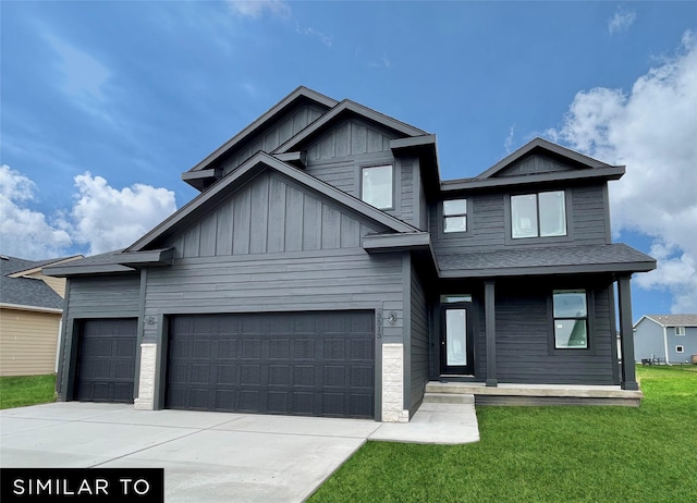 view of front of home featuring board and batten siding, a front yard, driveway, and an attached garage