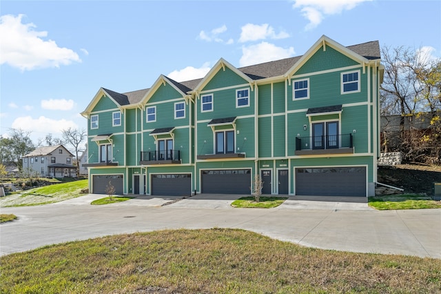 view of front of house with a balcony and a garage