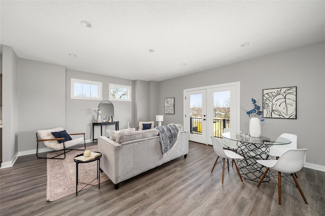 living room featuring a wealth of natural light and hardwood / wood-style flooring