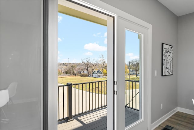 doorway with dark hardwood / wood-style floors