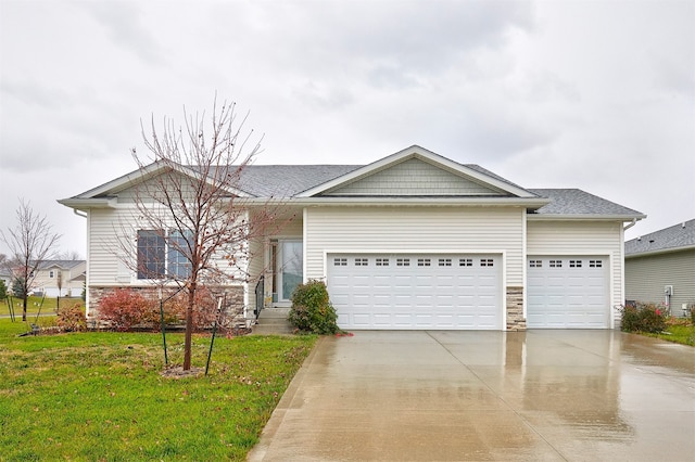 view of front of house with a garage and a front lawn