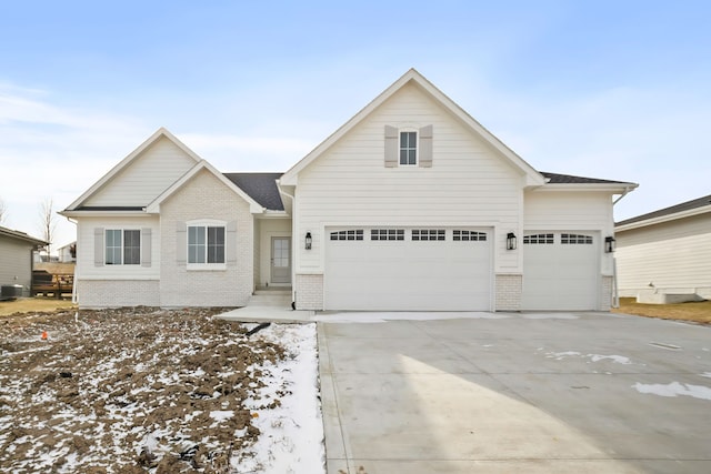 front of property featuring a garage and central AC