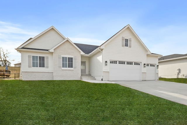 view of front of house featuring a garage and a front lawn