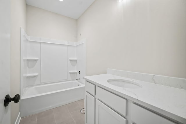 bathroom featuring tile patterned floors, bathtub / shower combination, and vanity