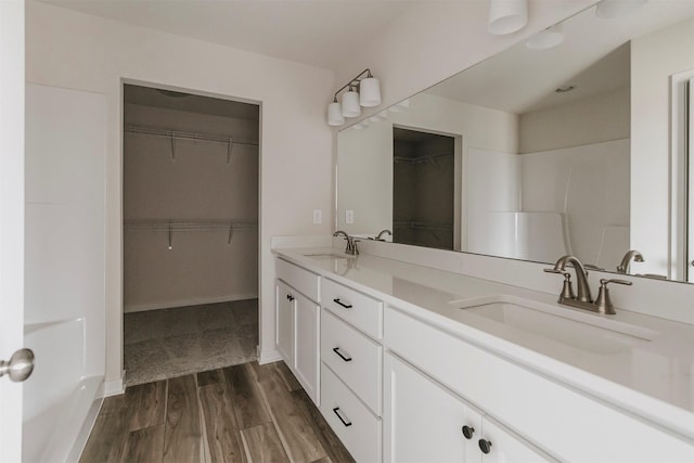 bathroom featuring vanity and hardwood / wood-style floors