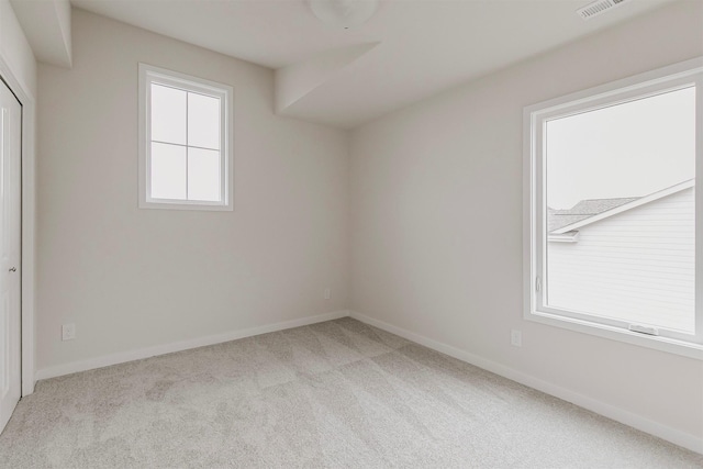 empty room featuring light colored carpet