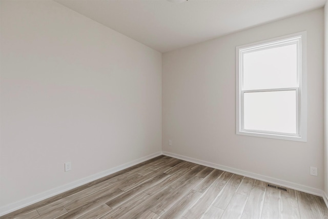 empty room with light wood-type flooring