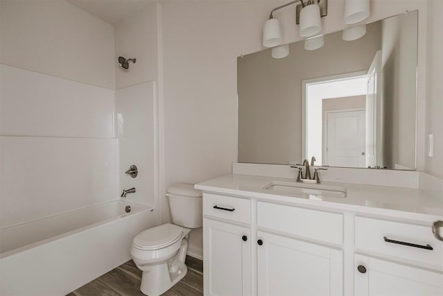 full bathroom with vanity, toilet, hardwood / wood-style floors, and shower / bathing tub combination