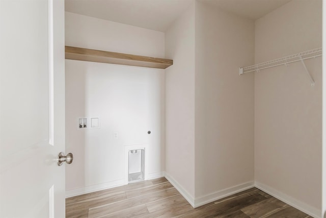 laundry room with wood-type flooring, hookup for an electric dryer, and washer hookup