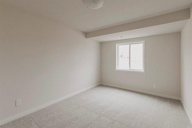 spare room featuring carpet floors