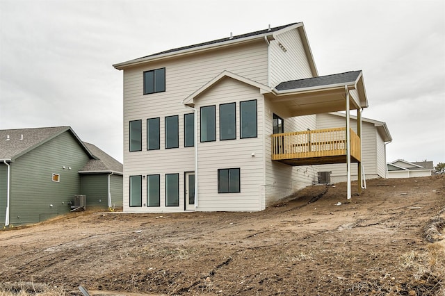 back of property featuring central AC and a balcony