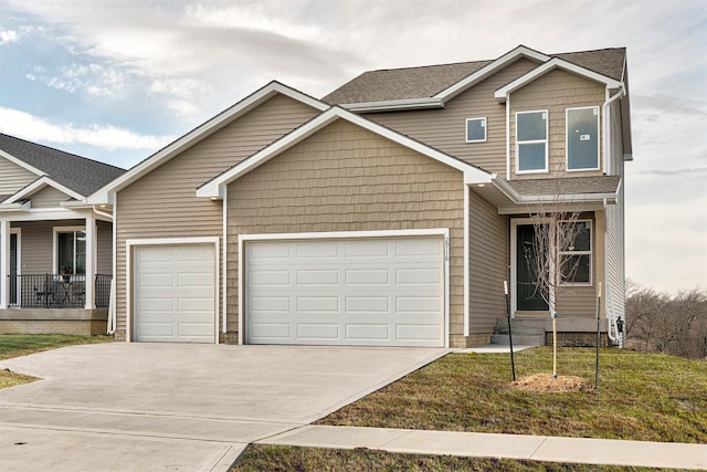 craftsman inspired home with a garage and a front yard