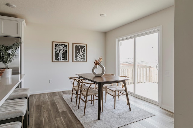 dining space featuring hardwood / wood-style flooring