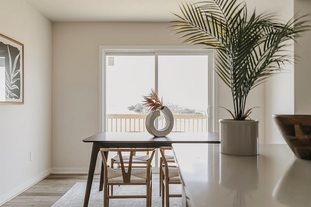 dining area featuring light wood-type flooring