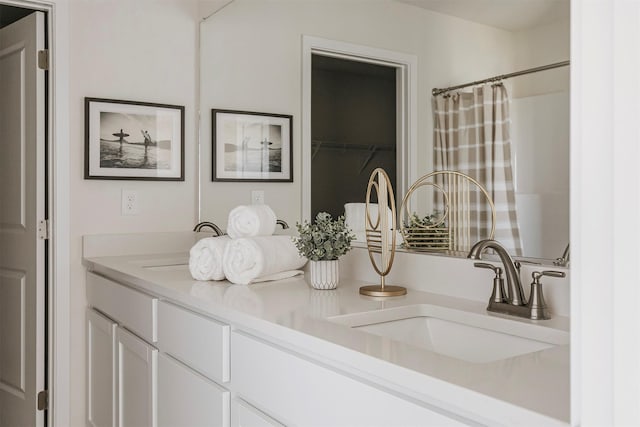 bathroom with vanity and curtained shower