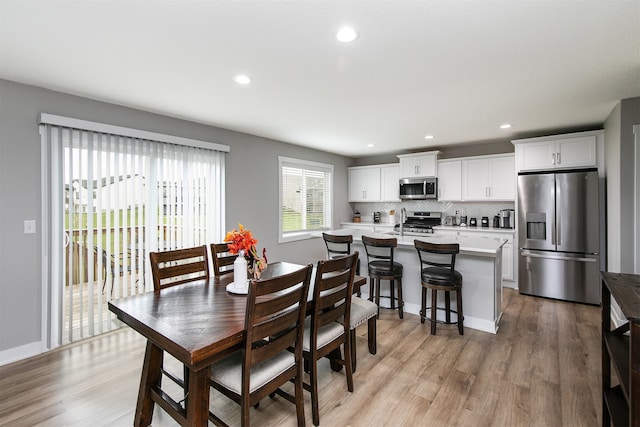 dining room with light wood-type flooring