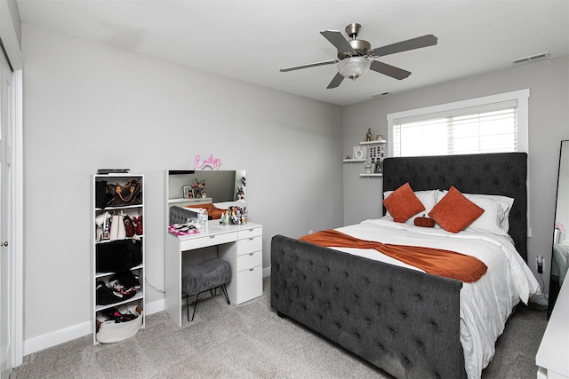 bedroom featuring ceiling fan, carpet floors, and a closet