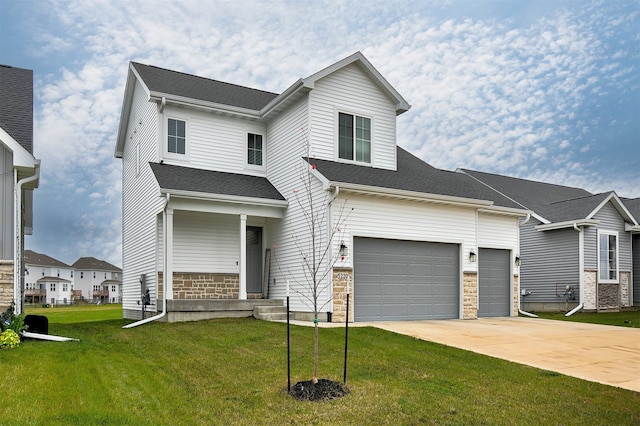 view of front of house featuring a garage and a front yard