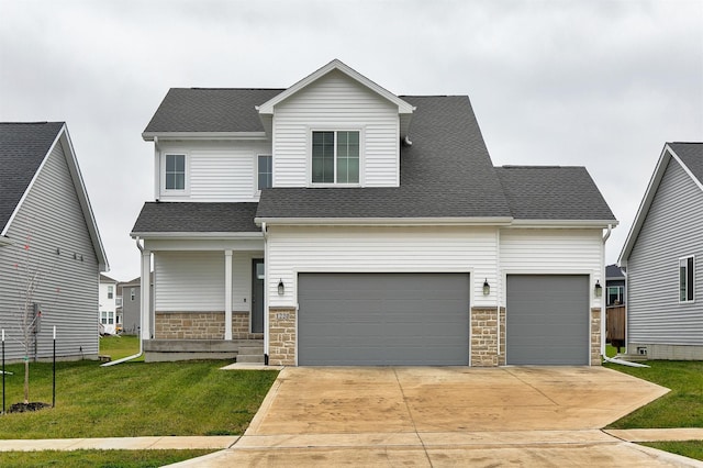 view of front of home featuring stone siding, concrete driveway, a front yard, and roof with shingles