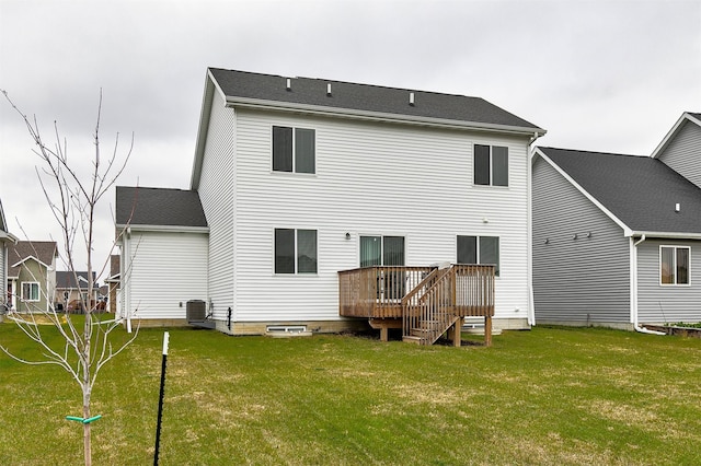 back of property featuring a lawn, central AC, and a deck