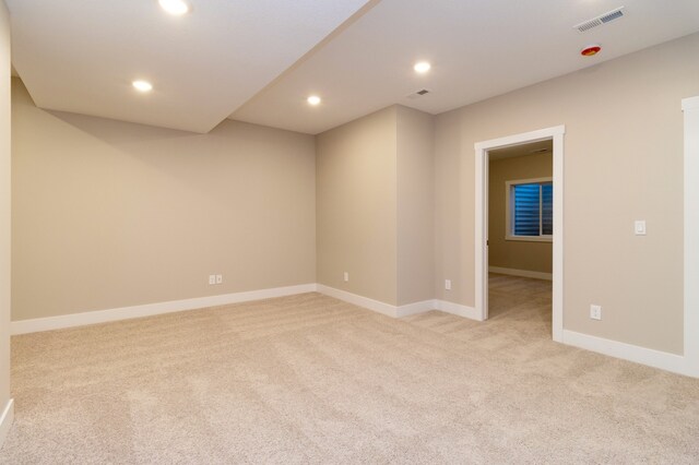 empty room with light colored carpet