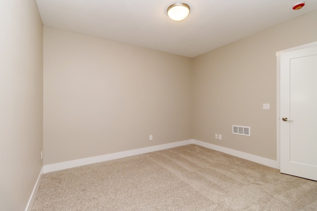 spare room with light colored carpet