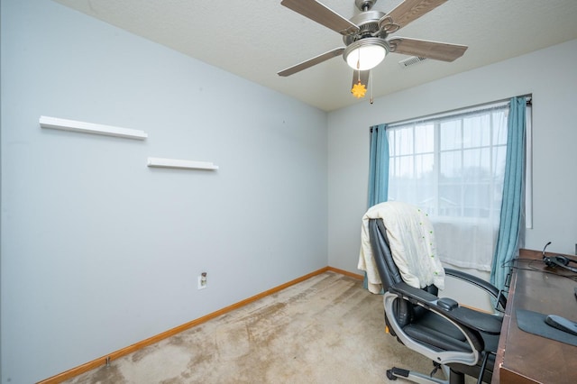 office space featuring light colored carpet and ceiling fan