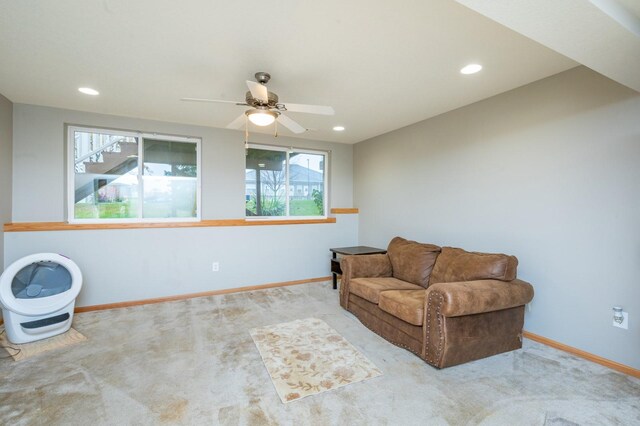 unfurnished room featuring light carpet and ceiling fan