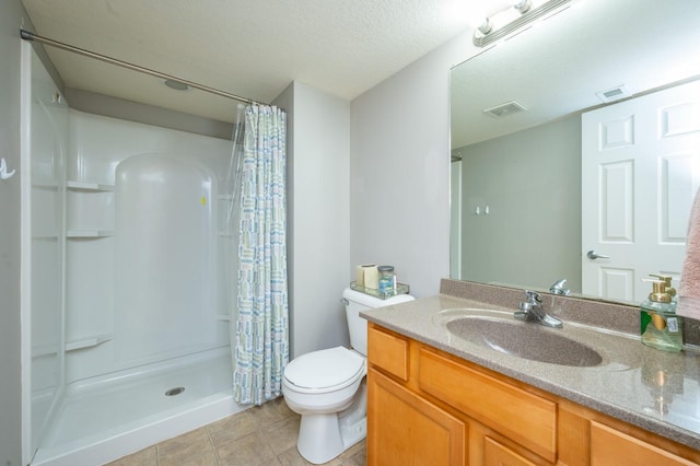 bathroom with a shower with shower curtain, a textured ceiling, vanity, and toilet