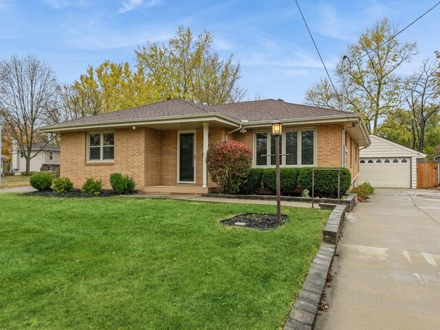 single story home featuring a garage and a front lawn