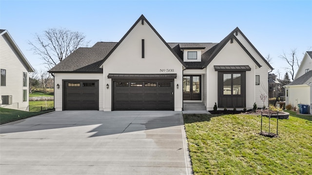 modern inspired farmhouse with cooling unit, a garage, a front yard, and french doors