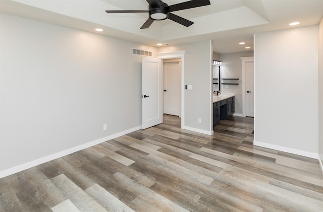 empty room featuring ceiling fan and light hardwood / wood-style floors