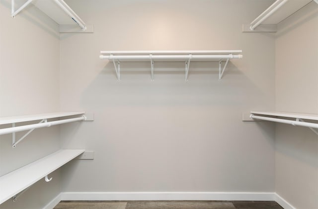 6562 Center St, West Des Moines, IA 50266 - spacious closet featuring wood finished floors