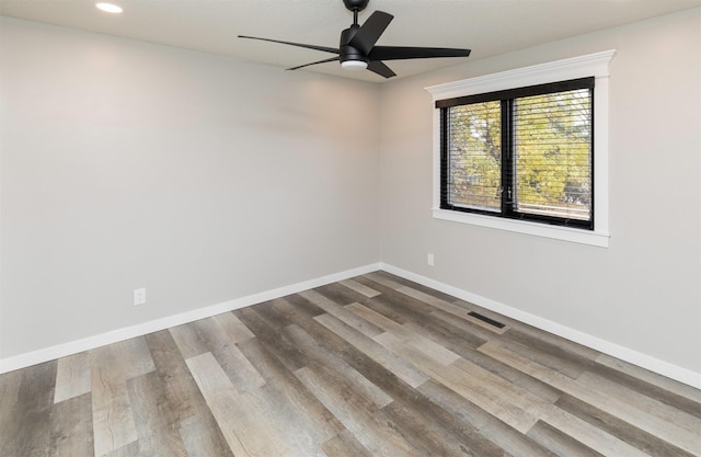 6562 Center St, West Des Moines, IA 50266 - spare room with a ceiling fan, baseboards, dark wood finished floors, and recessed lighting