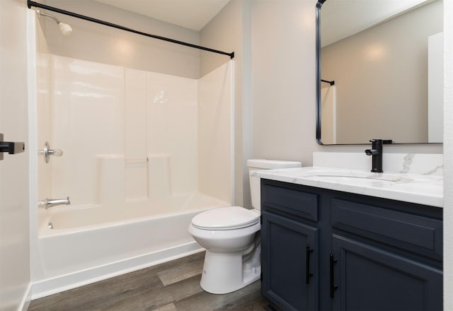 6562 Center St, West Des Moines, IA 50266 - full bath featuring wood finished floors, vanity, toilet, and  shower combination