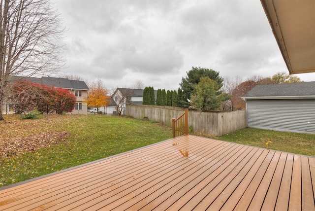 wooden deck with a lawn