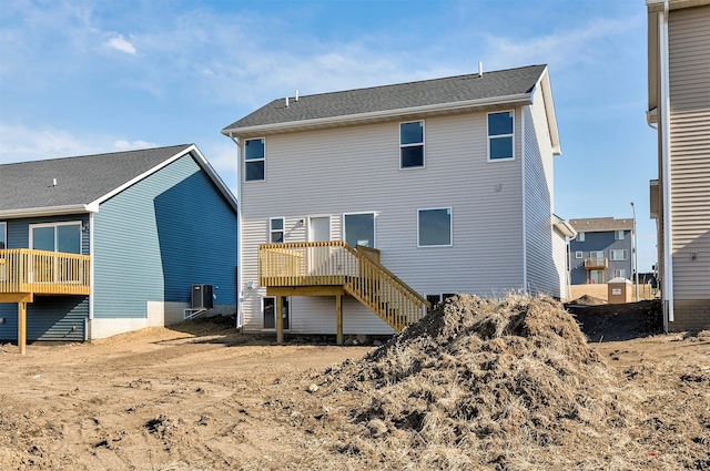 back of property with a wooden deck and central air condition unit