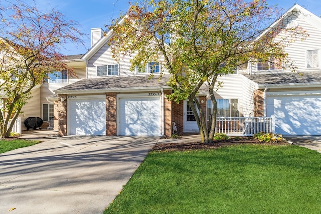 view of front property featuring a front yard and a garage