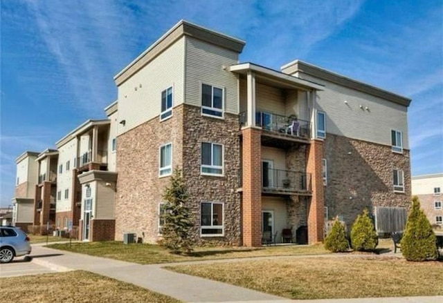 view of property featuring central AC unit