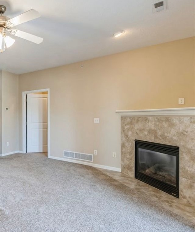 unfurnished living room featuring carpet flooring and ceiling fan