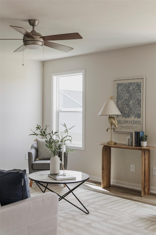 5130 Ella Ivy Ct, Van Meter, IA 50261 - living room with a ceiling fan, wood finished floors, and baseboards