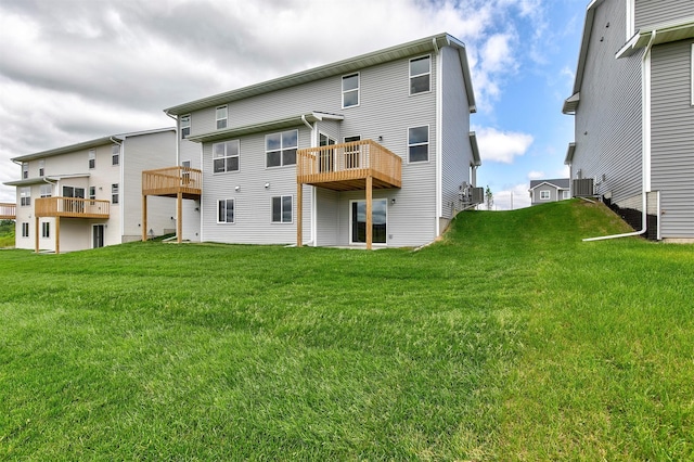 5130 Ella Ivy Ct, Van Meter, IA 50261 - back of property featuring a lawn, cooling unit, and a wooden deck
