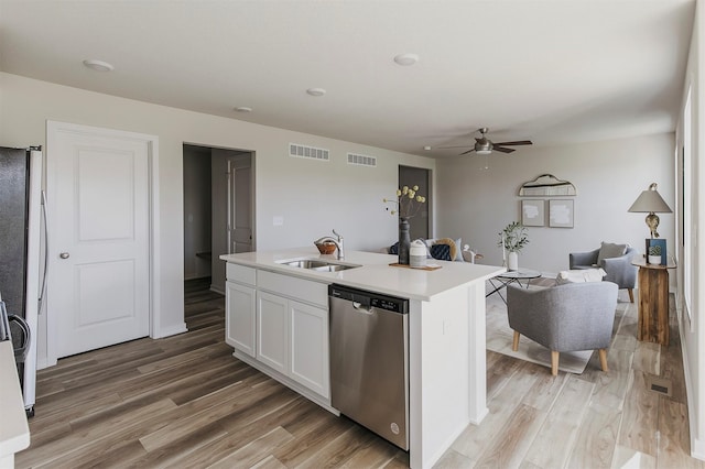 5130 Ella Ivy Ct, Van Meter, IA 50261 - kitchen featuring appliances with stainless steel finishes, a sink, a ceiling fan, light wood-style floors, and light countertops