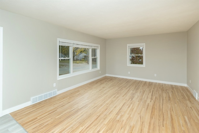 unfurnished room featuring light hardwood / wood-style floors