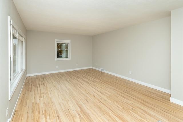 spare room with light wood-type flooring