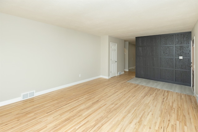 spare room with light wood-type flooring