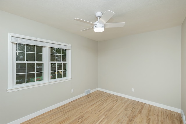 unfurnished room featuring light hardwood / wood-style floors and ceiling fan