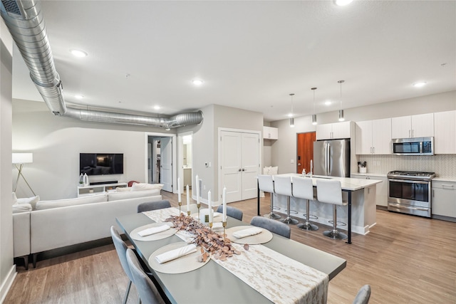 dining room featuring light hardwood / wood-style flooring