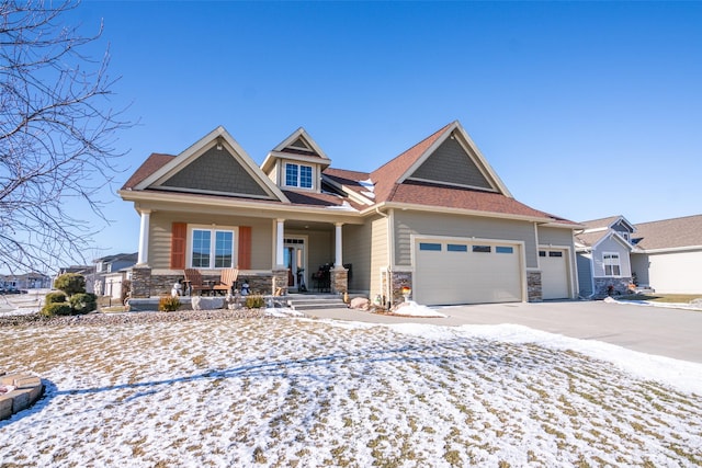 craftsman-style home with a porch and a garage