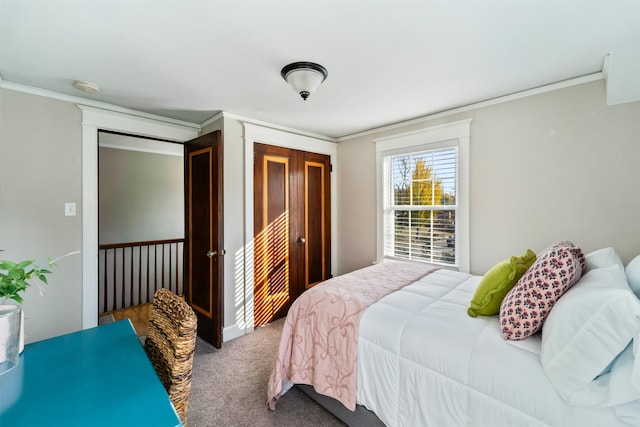 carpeted bedroom featuring crown molding